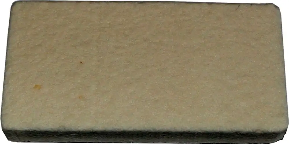 Rektangulärer Reinigungsstein in neutraler Farbe, geeignet für die Reinigung und Pflege von Heizkörpern. Produkt der Marke Wolf.